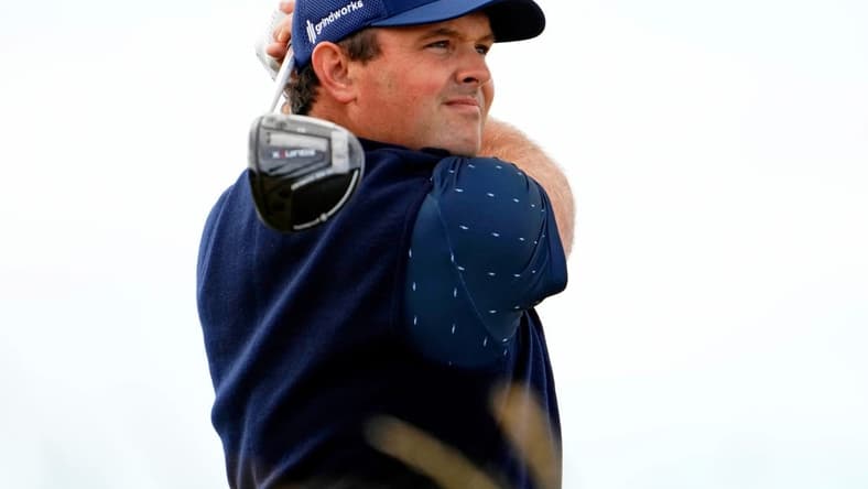 Jul 14, 2022; St. Andrews, SCT; Patrick Reed tees off on the sixth hole during the first round of the 150th Open Championship golf tournament at St. Andrews Old Course. Mandatory Credit: Rob Schumacher-USA TODAY Sports