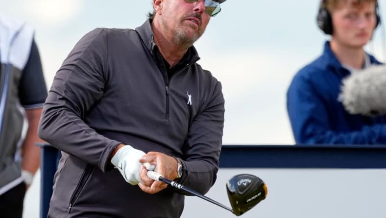 Jul 15, 2022; St. Andrews, SCT; Phil Mickelson tees off on the 15th hole during the second round of the 150th Open Championship golf tournament at St. Andrews Old Course. Mandatory Credit: Michael Madrid-USA TODAY Sports