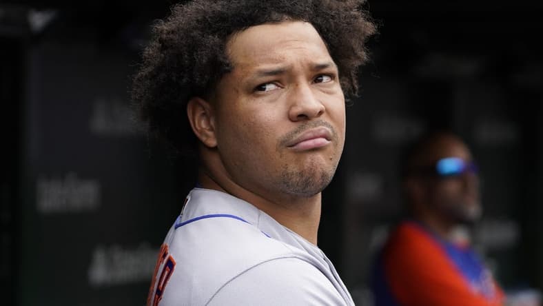 Jul 16, 2022; Chicago, Illinois, USA; New York Mets starting pitcher Taijuan Walker (99) in the dugout during the fifth inning in game one of a doubleheader at Wrigley Field. Mandatory Credit: David Banks-USA TODAY Sports