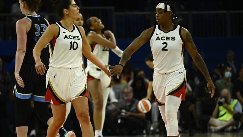 Jul 26, 2022; Chicago, IL, USA; Las Vegas Aces guard Kelsey Plum (10) and Las Vegas Aces guard Riquna Williams (2) high five against the Chicago Sky during the second half of the Commissioners Cup-Championships at Wintrust Arena. Mandatory Credit: Matt Marton-USA TODAY Sports