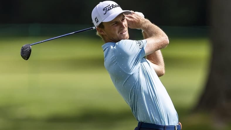 Jul 28, 2022; Detroit, Michigan, USA; Will Zalatoris hits his second shot on the par 5 fourteenth hole during the first round of the Rocket Mortgage Classic golf tournament. Mandatory Credit: Raj Mehta-USA TODAY Sports