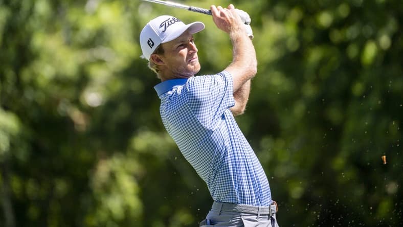 Jul 29, 2022; Detroit, Michigan, USA; Will Zalatoris tees off on the par 3 ninth hole during the second round of the Rocket Mortgage Classic golf tournament. Mandatory Credit: Raj Mehta-USA TODAY Sports