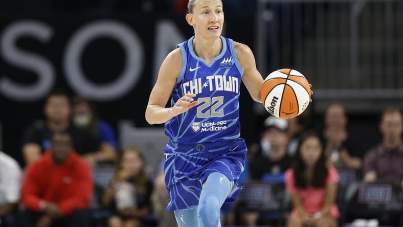 Jul 29, 2022; Chicago, Illinois, USA; Chicago Sky guard Courtney Vandersloot (22) brings the ball up court during the first half of the WNBA game against the New York Liberty at Wintrust Arena. Mandatory Credit: Kamil Krzaczynski-USA TODAY Sports