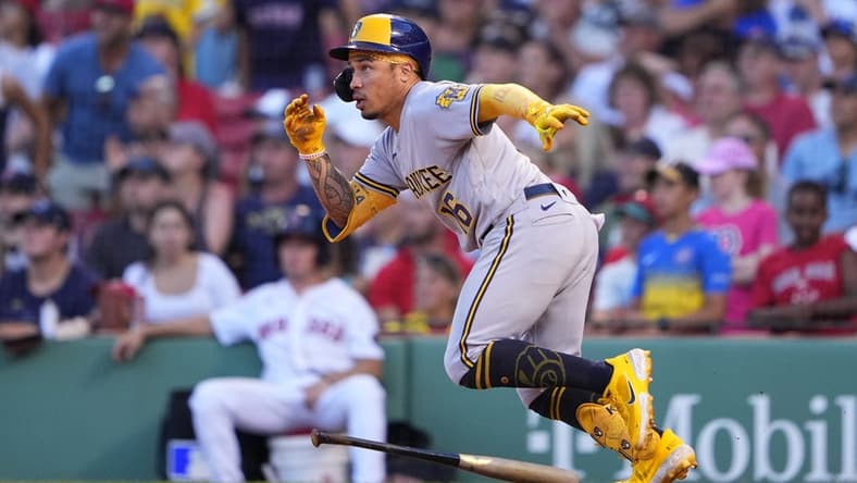 Jul 30, 2022; Boston, Massachusetts, USA; Milwaukee Brewers second baseman Kolten Wong (16) runs out a double against the Boston Red Sox during the ninth inning at Fenway Park. Mandatory Credit: Gregory Fisher-USA TODAY Sports