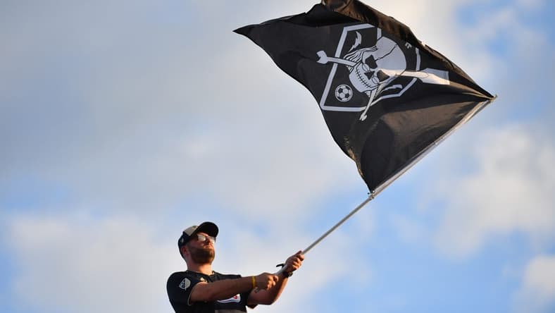 Jul 30, 2022; Chester, Pennsylvania, USA; Philadelphia Union fan waves the flag against the Houston Dynamo at Subaru Park. Mandatory Credit: Eric Hartline-USA TODAY Sports