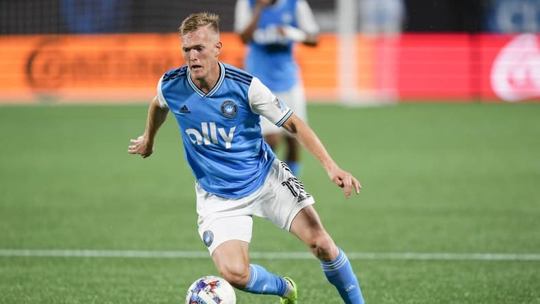 Jul 30, 2022; Charlotte, North Carolina, USA; Charlotte FC forward Karol Swiderski (11) brings the ball up field against the Columbus Crew during the first half at Bank of America Stadium. Mandatory Credit: Jim Dedmon-USA TODAY Sports