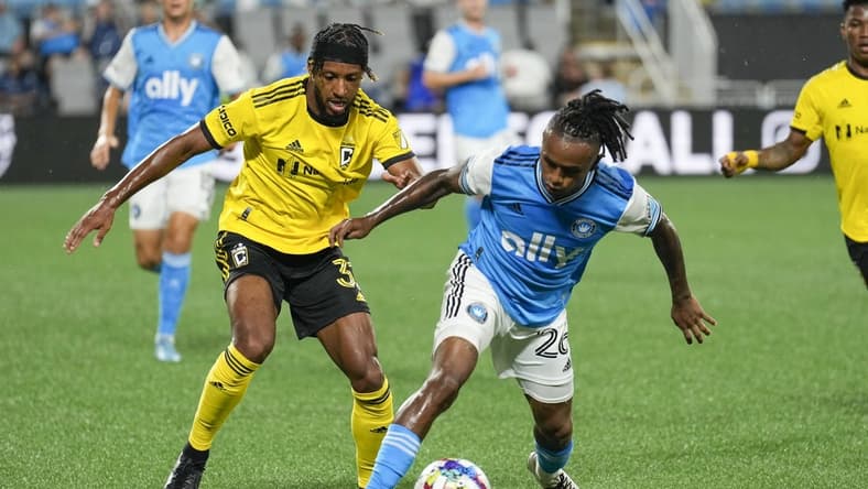 Jul 30, 2022; Charlotte, North Carolina, USA; Columbus Crew defender Steven Moreira (31) tries to steal the ball from Charlotte FC forward Yordi Reyna (26) during the first half at Bank of America Stadium. Mandatory Credit: Jim Dedmon-USA TODAY Sports