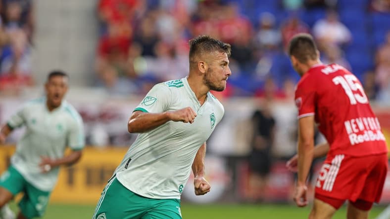 Aug 2, 2022; Harrison, New Jersey, USA; Colorado Rapids forward Diego Rubio (11) celebrates his goal in front of New York Red Bulls defender Sean Nealis (15) during the first half at Red Bull Arena. Mandatory Credit: Vincent Carchietta-USA TODAY Sports