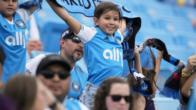 Aug 3, 2022; Charlotte, North Carolina, USA; A young Charlotte FC fan shows his colors during the first half against the D.C. United at Bank of America Stadium. Mandatory Credit: Jim Dedmon-USA TODAY Sports