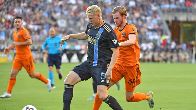 Jul 30, 2022; Chester, Pennsylvania, USA; Philadelphia Union defender Jakob Glesnes (5) shields the ball from Houston Dynamo forward   orleifur   lfarsson (34) during the first half at Subaru Park. Mandatory Credit: Eric Hartline-USA TODAY Sports