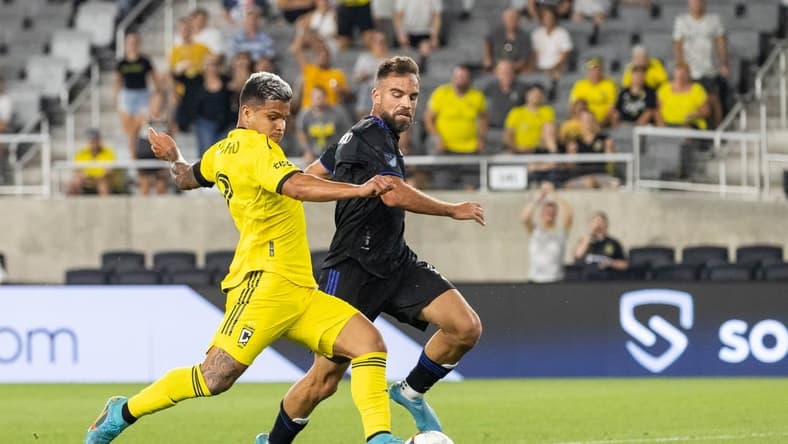 Aug 3, 2022; Columbus, Ohio, USA; Columbus Crew forward Cucho (9) kicks the ball while CF Montreal defender Rudy Camacho (4) defends in the second half at Lower.com Field. Mandatory Credit: Trevor Ruszkowski-USA TODAY Sports