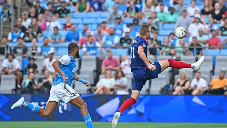 Aug 6, 2022; Charlotte, North Carolina, USA; Chicago Fire attacker Kacper Przybylko (11) controls the ball in front of Charlotte FC defender Anton Walkes (left) in the first half at Bank of America Stadium. Mandatory Credit: Griffin Zetterberg-USA TODAY Sports