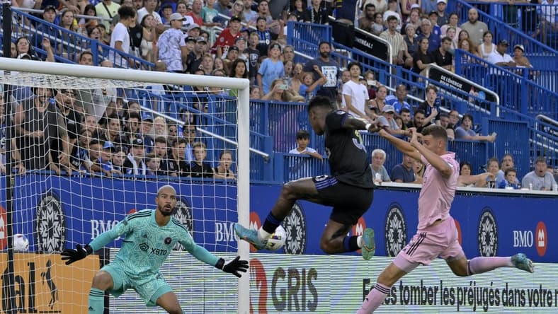 Aug 6, 2022; Montreal, Quebec, CAN; CF Montreal midfielder Romell Quioto (30) scores a goal against Inter Miami CF goalkeeper Drake Callender (27) during the first half at Stade Saputo. Mandatory Credit: Eric Bolte-USA TODAY Sports