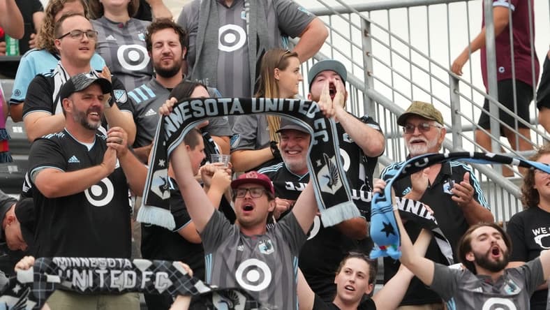 Aug 6, 2022; Commerce City, Colorado, USA; Minnesota United FC fans celebrate after a goal against the Colorado Rapids in the first half at Dick's Sporting Goods Park. Mandatory Credit: Ron Chenoy-USA TODAY Sports
