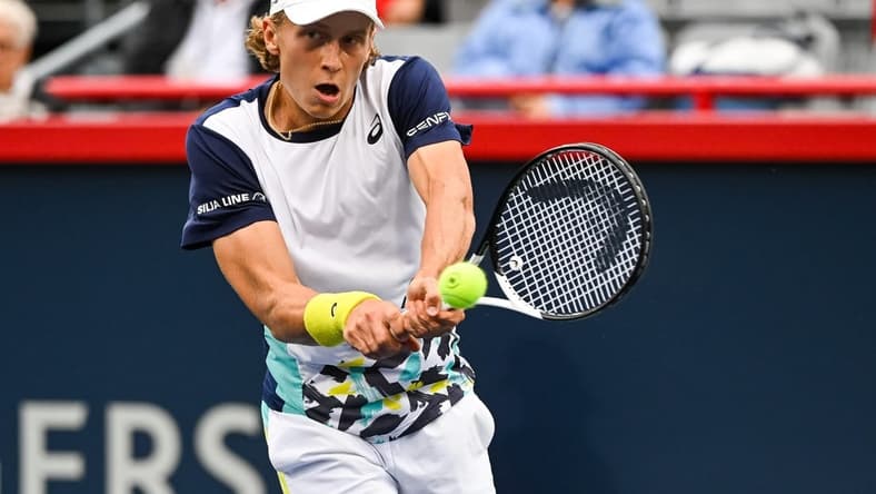 Aug 8, 2022; Montreal, Quebec, Canada; Emil Ruusuvuori (FIN) hits a shot against Stan Wawrinka (SUI) (not pictured)  during first round play at IGA Stadium. Mandatory Credit: David Kirouac-USA TODAY Sports