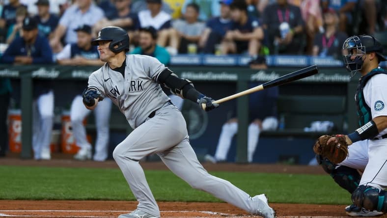 Aug 8, 2022; Seattle, Washington, USA; New York Yankees third baseman Josh Donaldson (28) hits a two-run single against the Seattle Mariners during the first inning at T-Mobile Park. Mandatory Credit: Joe Nicholson-USA TODAY Sports