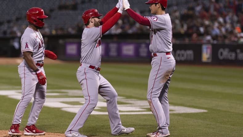 Aug 9, 2022; Oakland, California, USA; Los Angeles Angels starting pitcher Shohei Ohtani (17) celebrates with Los Angeles Angels right fielder Taylor Ward (3) after hitting a three run homerun during the fifth inning against the Oakland Athletics at RingCentral Coliseum. Mandatory Credit: Stan Szeto-USA TODAY Sports