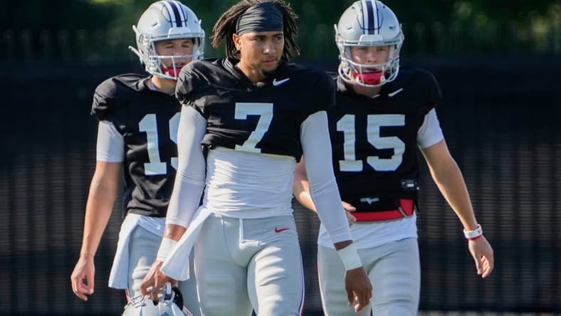 Aug 11, 2022; Columbus, OH, USA;  Ohio State Buckeyes quarterback C.J. Stroud (7) walks with quarterback Devin Brown (15) and quarterback Chad Ray (19) during football camp at the Woody Hayes Athletic Center. Mandatory Credit: Adam Cairns-The Columbus Dispatch

Ohio State Football Camp