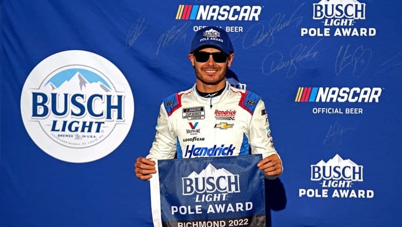Aug 13, 2022; Richmond, Virginia, USA; NASCAR Cup Series driver Kyle Larson (5) celebrates winning the pole during practice and qualifying for the Federated Auto Parts 400 at Richmond International Raceway. Mandatory Credit: Peter Casey-USA TODAY Sports