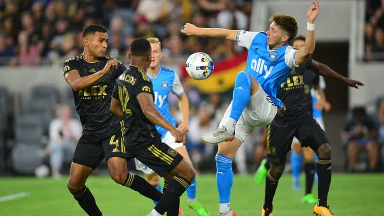 Aug 13, 2022; Los Angeles, California, USA; Charlotte FC midfielder Quinn McNeill (35) plays for the ball against Los Angeles FC during the first half at Banc of California Stadium. Mandatory Credit: Gary A. Vasquez-USA TODAY Sports