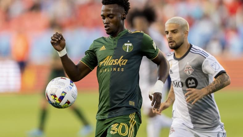 Aug 13, 2022; Toronto, Ontario, CAN; Portland Timbers midfielder Santiago Moreno (30) moves the ball against Toronto FC during the first half at BMO Field. Mandatory Credit: Kevin Sousa-USA TODAY Sports