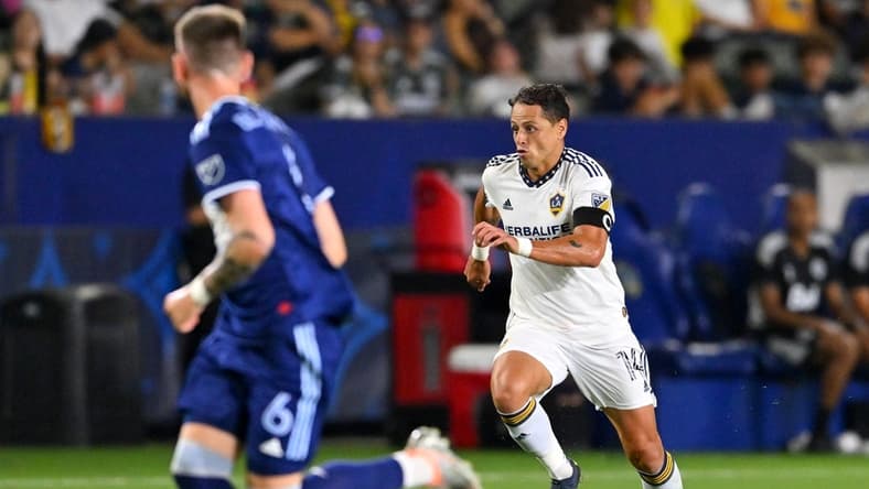 Aug 13, 2022; Carson, California, USA;   Los Angeles Galaxy forward Javier Hern  ndez (14) as he takes the ball down field in the second half against the Vancouver Whitecaps at Dignity Health Sports Park. Mandatory Credit: Jayne Kamin-Oncea-USA TODAY Sports