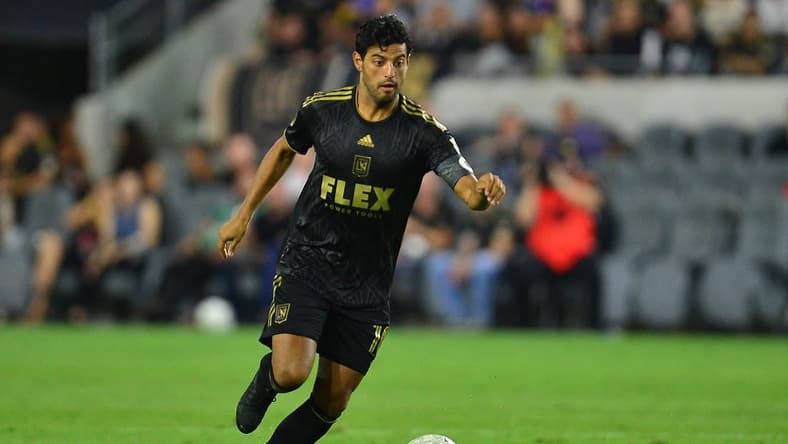 Aug 13, 2022; Los Angeles, California, USA; Los Angeles FC forward Carlos Vela (10) moves the ball against Charlotte FC during the second half at Banc of California Stadium. Mandatory Credit: Gary A. Vasquez-USA TODAY Sports