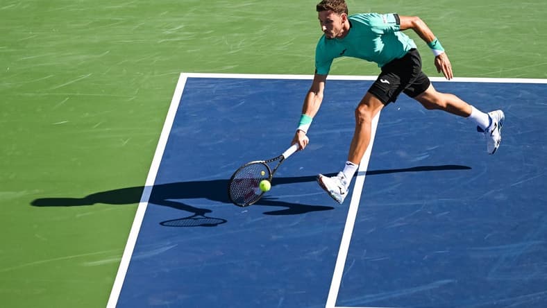 Aug 14, 2022; Montreal, QC, Canada; Pablo Carreno Busta (ESP) hits a shot against Hubert Hurkacz (POL) (not pictured) in the singles final match during during the National Bank Open at IGA Stadium. Mandatory Credit: David Kirouac-USA TODAY Sports