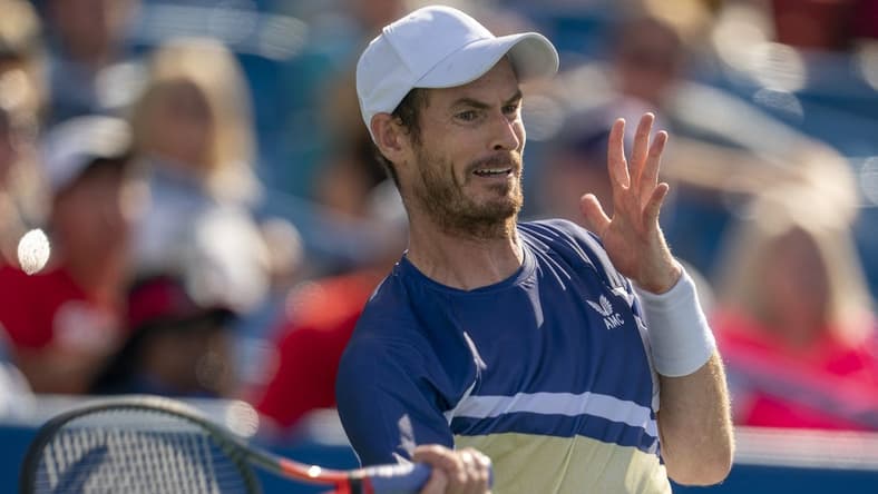 Aug 15, 2022; Cincinnati, OH, USA;  Andy Murray (GBR) returns a shot during his match against Stanislas Wawrinka (SUI) at the Western & Southern at the at the Lindner Family Tennis Center. Mandatory Credit: Susan Mullane-USA TODAY Sports