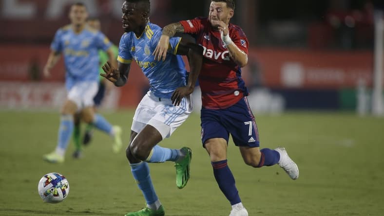 Aug 17, 2022; Frisco, Texas, USA; Philadelphia Union forward Cory Burke (19) controls the ball against FC Dallas forward Paul Arriola (7) in the first half at Toyota Stadium. Mandatory Credit: Tim Heitman-USA TODAY Sports