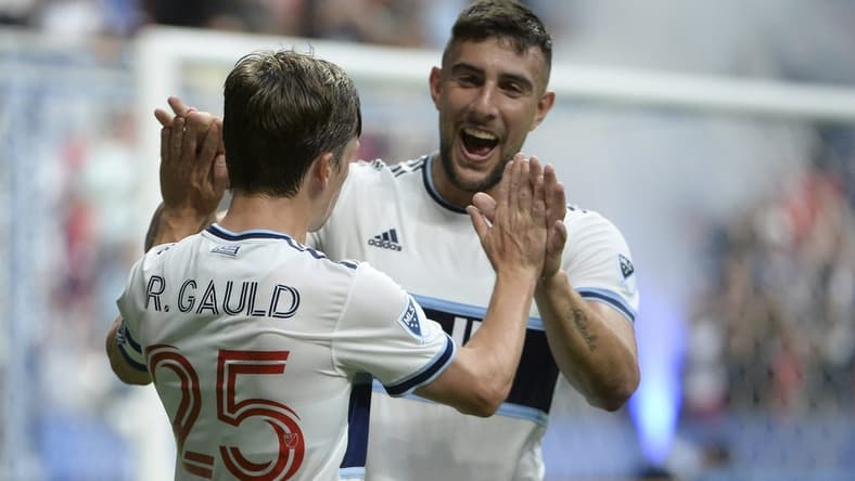 Aug 17, 2022; Vancouver, British Columbia, CAN;  Vancouver Whitecaps FC midfielder Ryan Gauld (25) celebrates his goal with forward Lucas Cavallini (9) after scoring against Colorado Rapids goalkeeper William Yarbrough (22) (not pictured) during the first half at BC Place. Mandatory Credit: Anne-Marie Sorvin-USA TODAY Sports