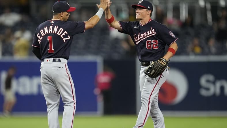 Aug 19, 2022; San Diego, California, USA; Washington Nationals right fielder Alex Call (62) greets second baseman Cesar Hernandez (1) after the game against the San Diego Padres at Petco Park. Mandatory Credit: Ray Acevedo-USA TODAY Sports
