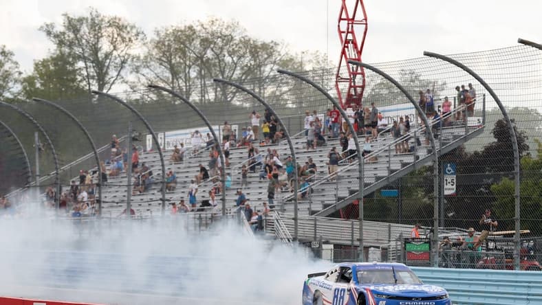 Aug 20, 2022; Watkins Glen, New York, USA; NASCAR Xfinity Series driver Kyle Larson (88) celebrates after winning the Sunoco Go Rewards 200 at Watkins Glen International. Mandatory Credit: Matthew OHaren-USA TODAY Sports