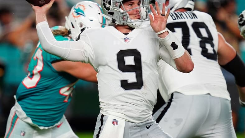 Aug 20, 2022; Miami Gardens, Florida, USA; Las Vegas Raiders quarterback Nick Mullens (9) throws a pass against the Miami Dolphins in the second quarter at Hard Rock Stadium. Mandatory Credit: Jim Rassol-USA TODAY Sports