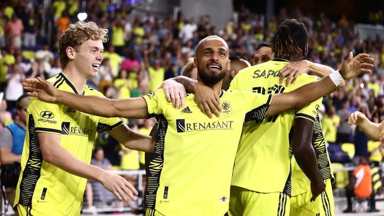 Aug 21, 2022; Nashville, Tennessee, USA;  Nashville SC midfielder Hany Mukhtar (10) celebrates after scoring against FC Dallas in the first half at Geodis Park. Mandatory Credit: Casey Gower-USA TODAY Sports