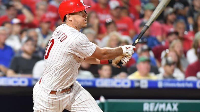 Aug 23, 2022; Philadelphia, Pennsylvania, USA; Philadelphia Phillies catcher J.T. Realmuto (10) hits a two RBI triple against the Cincinnati Reds during the sixth inning at Citizens Bank Park. Mandatory Credit: Eric Hartline-USA TODAY Sports