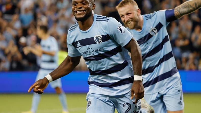 Aug 21, 2022; Kansas City, Kansas, USA; Sporting Kansas City forward William Agada (23) celebrates with forward Johnny Russell (7) after scoring goal at Children's Mercy Park. Mandatory Credit: Gary Rohman-USA TODAY Sports