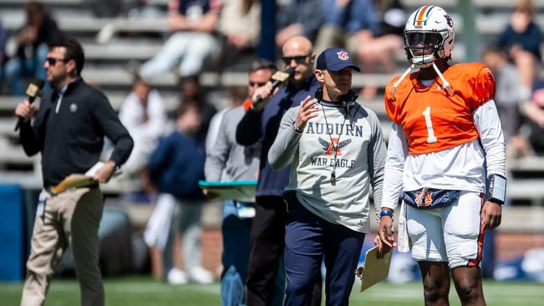 Auburn Tigers head coach Bryan Harsin talks with Auburn Tigers quarterback T.J. Finley (1) during the A-Day spring practice at Jordan-Hare Stadium in Auburn, Ala., on Saturday, April 9, 2022.