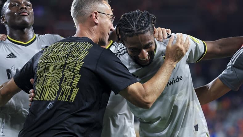 Aug 27, 2022; Cincinnati, Ohio, USA;  Columbus Crew SC head coach Caleb Porter (left) hugs defender Steven Moreira as they celebrate after the game against FC Cincinnati at TQL Stadium. Mandatory Credit: Aaron Doster-USA TODAY Sports