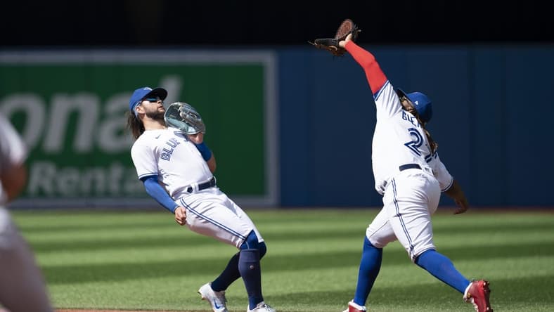 Aug 28, 2022; Toronto, Ontario, CAN; Toronto Blue Jays first baseman Vladimir Guerrero Jr. (27) catches a fly ball against the Los Angeles Angels during the third inning at Rogers Centre. Mandatory Credit: Nick Turchiaro-USA TODAY Sports