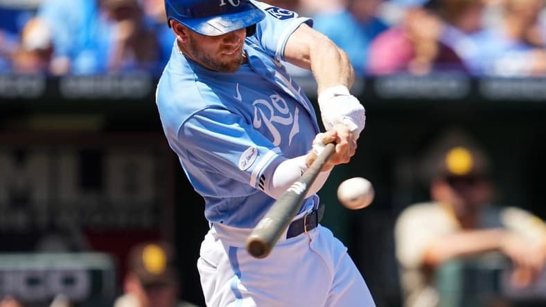 Aug 28, 2022; Kansas City, Missouri, USA; Kansas City Royals third baseman Hunter Dozier (17) hits a single against the San Diego Padres during the first inning at Kauffman Stadium. Mandatory Credit: Jay Biggerstaff-USA TODAY Sports