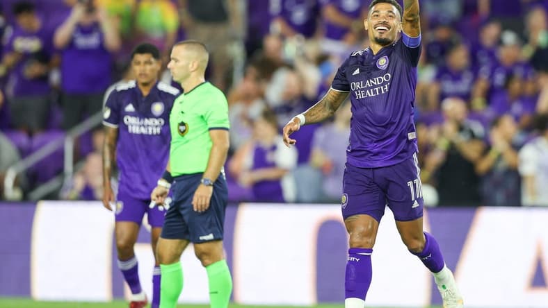 Aug 28, 2022; Orlando, Florida, USA;  Orlando City midfielder Junior Urso (11) reacts after scoring a goal against New York City FC in the first half at Exploria Stadium. Mandatory Credit: Nathan Ray Seebeck-USA TODAY Sports