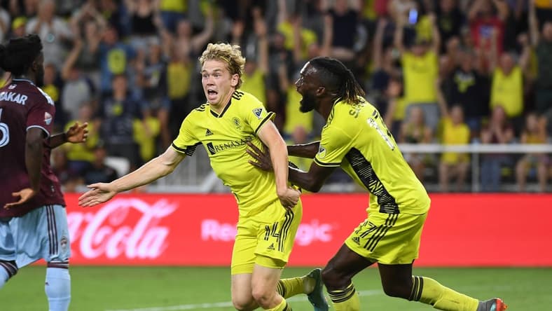 Aug 31, 2022; Nashville, Tennessee, USA; Nashville SC midfielder Jacob Shaffelburg (14) celebrates after scoring during the second half against the Colorado Rapids at Geodis Park. Mandatory Credit: Christopher Hanewinckel-USA TODAY Sports