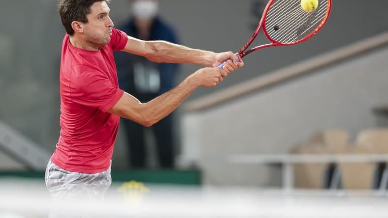 Sep 29, Paris, France; Gilles Simon (FRA) in action during his match against Denis Shapovalov (CAN) on day three at Stade Roland Garros. Mandatory Credit: Susan Mullane-USA TODAY Sports