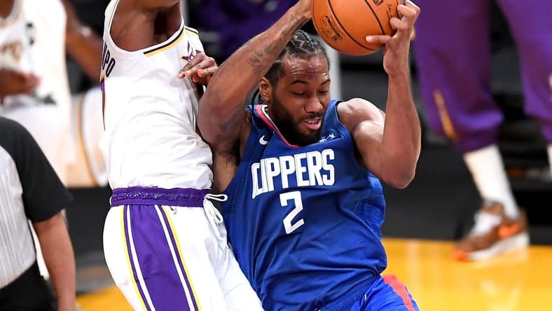 Dec 11, 2020; Los Angeles, California, USA;   Los Angeles Lakers forward Kostas Antetokounmpo (37) battles Los Angeles Clippers forward Kawhi Leonard (2) for a rebound in the first half of the game at Staples Center. Mandatory Credit: Jayne Kamin-Oncea-USA TODAY Sports