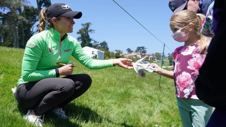 Jun 6, 2021; San Francisco, California, USA; Gaby Lopez gives a signed glove to a young golf spectator during the final round of the U.S. Women's Open golf tournament at The Olympic Club. Mandatory Credit: Kyle Terada-USA TODAY Sports