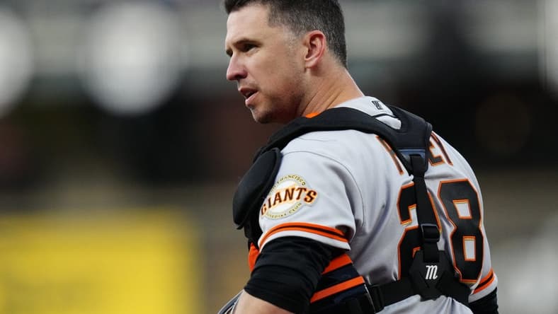 Sep 24, 2021; Denver, Colorado, USA; San Francisco Giants catcher Buster Posey (28) looks to towards the dugout in the first inning against the Colorado Rockies at Coors Field. Mandatory Credit: Ron Chenoy-USA TODAY Sports
