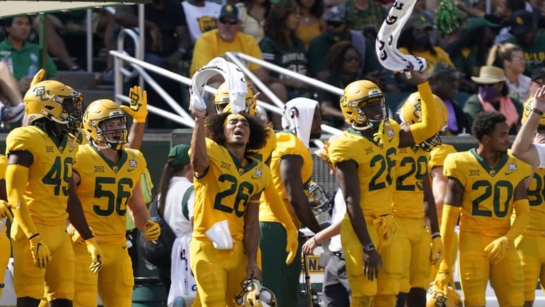 Sep 25, 2021; Waco, Texas, USA; Baylor Bears players wave their towels in the first half of the game against the Iowa State Cyclones at McLane Stadium. Mandatory Credit: Scott Wachter-USA TODAY Sports