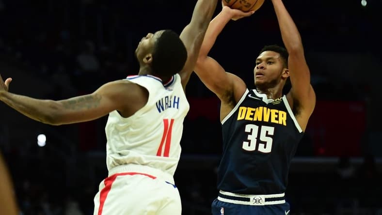 Oct 4, 2021; Los Angeles, California, USA; Denver Nuggets guard PJ Dozier (35) shoots against Los Angeles Clippers forward Moses Wright (11) during the second half at Staples Center. Mandatory Credit: Gary A. Vasquez-USA TODAY Sports
