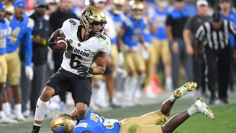 Nov 13, 2021; Pasadena, California, USA; Colorado Buffaloes wide receiver Daniel Arias (6) is tackled by UCLA Bruins defensive back Cameron Johnson (3) in the second half at Rose Bowl. Mandatory Credit: Jayne Kamin-Oncea-USA TODAY Sports
